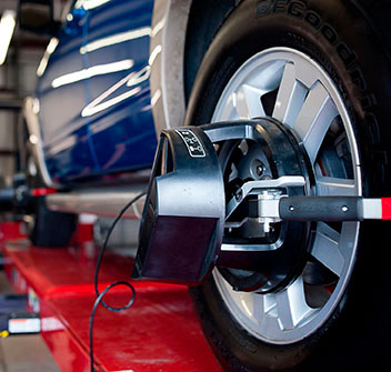 Working on 4-wheel alignment services