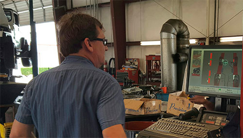 Mark working on 4-Wheel Alignment with Hunter Hawkeye System